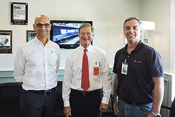VP Art Raynes, Congressman Lamar Smith, and VP Mike Petrusch